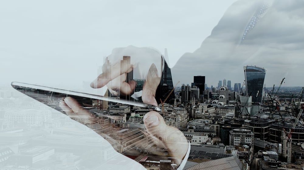 Businessman working with modern computer and london city background.