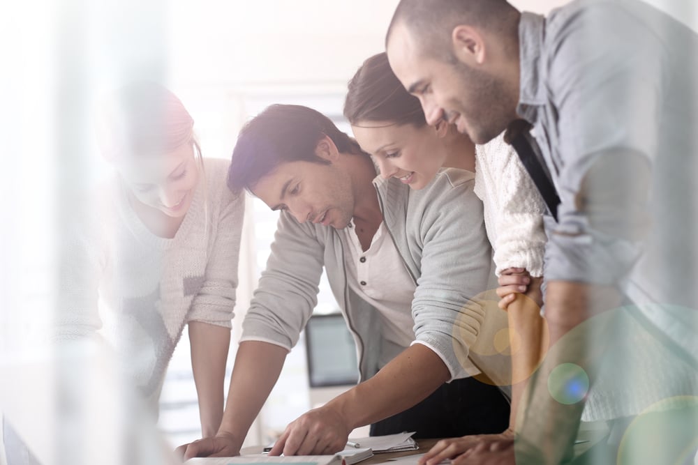 Group of business people in office working on project