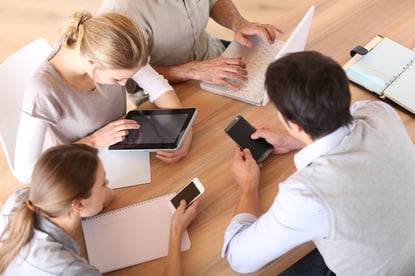 Group of business people using electronic devices at work-2