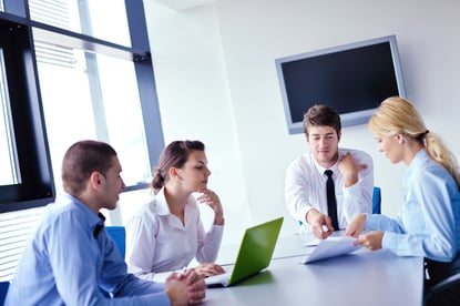 Group of happy young  business people in a meeting at office