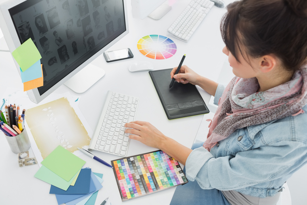 High angle view of an artist drawing something on graphic tablet at the office-1