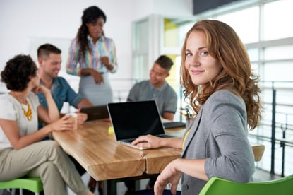 Image of a succesful casual business woman using laptop during meeting-2