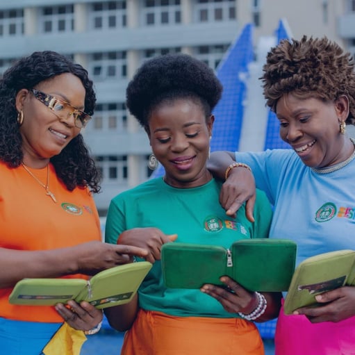 Three women looking at ipads. 