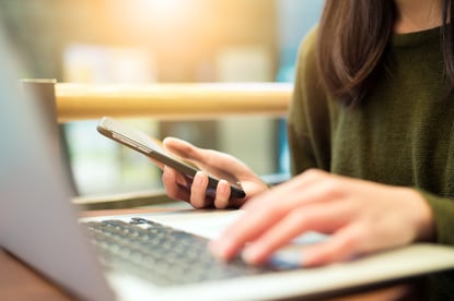 Woman using a mobile app to pay online