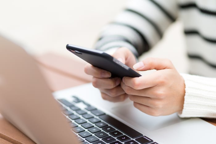 Woman using an app to pay online