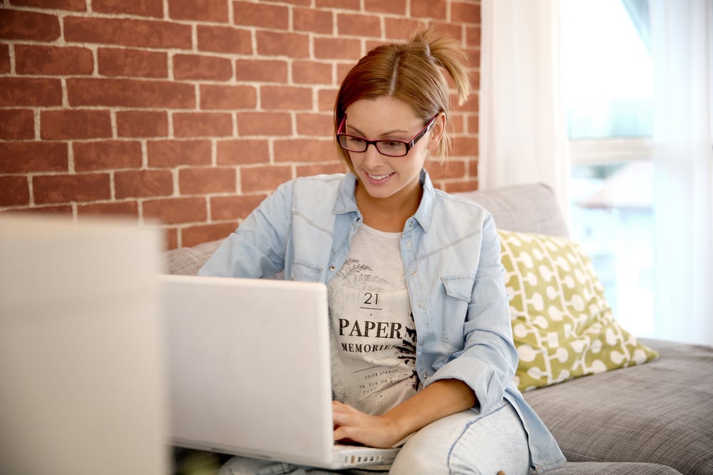 Young woman using laptop computer at home-2